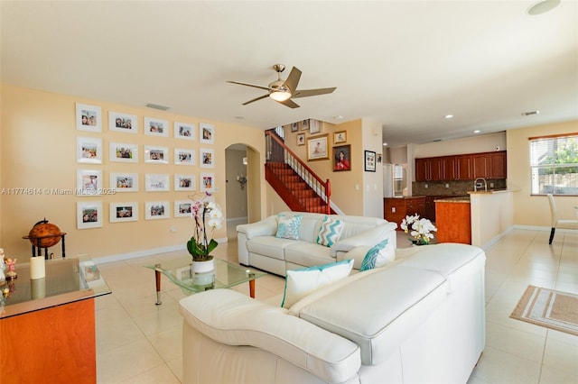1411 SW 149th Pl, Miami, FL 33194 - living area featuring arched walkways, ceiling fan, light tile patterned floors, stairs, and recessed lighting
