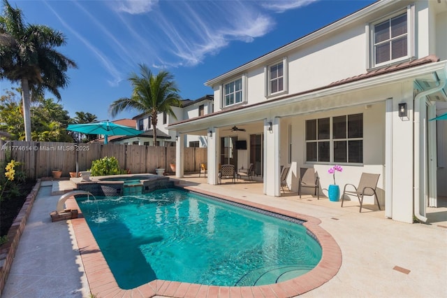 1411 SW 149th Pl, Miami, FL 33194 - view of swimming pool with a fenced backyard, a ceiling fan, a patio, and a pool with connected hot tub
