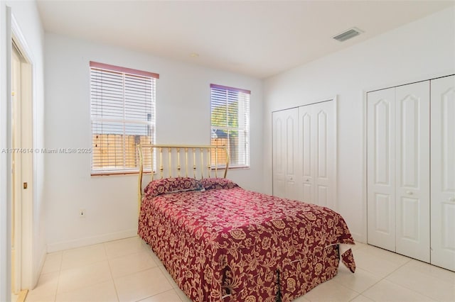 1411 SW 149th Pl, Miami, FL 33194 - bedroom featuring multiple closets and light tile patterned floors