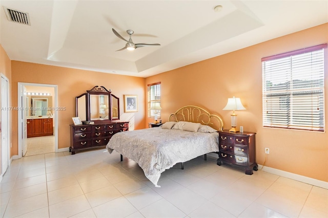 1411 SW 149th Pl, Miami, FL 33194 - bedroom with a raised ceiling, ensuite bathroom, light tile patterned floors, and ceiling fan