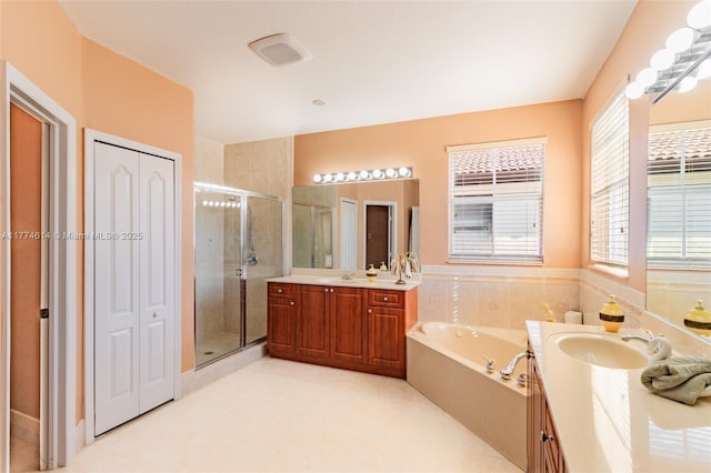 1411 SW 149th Pl, Miami, FL 33194 - bathroom with a shower stall, two vanities, a garden tub, and a closet