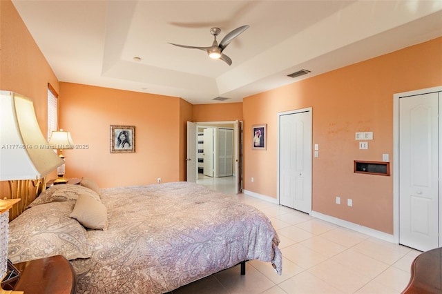 1411 SW 149th Pl, Miami, FL 33194 - bedroom featuring a raised ceiling, light tile patterned floors, and ceiling fan