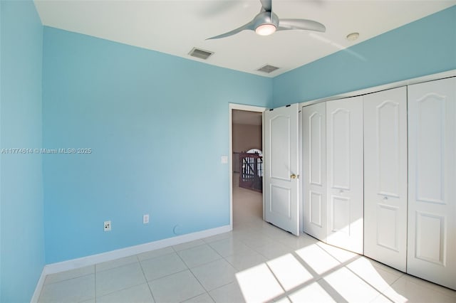 1411 SW 149th Pl, Miami, FL 33194 - unfurnished bedroom with a closet, light tile patterned floors, and ceiling fan
