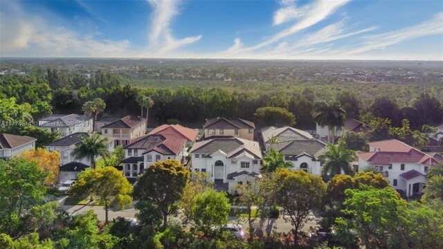 1411 SW 149th Pl, Miami, FL 33194 - aerial perspective of suburban area featuring a forest