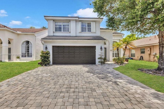 10766 Crescendo Cir, Boca Raton, FL 33498 - view of front of home featuring decorative driveway, a front yard, stucco siding, a garage, and a tiled roof