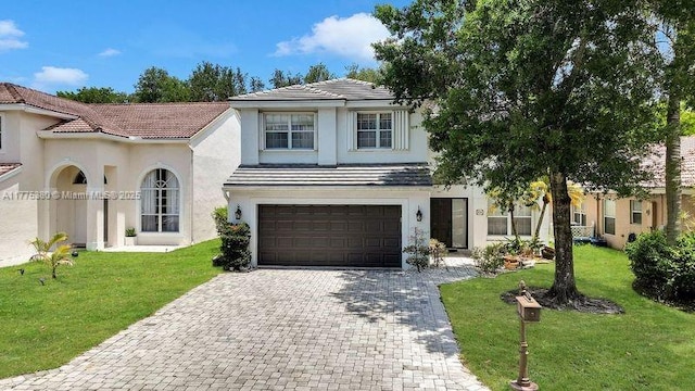 10766 Crescendo Cir, Boca Raton, FL 33498 - view of front of property featuring decorative driveway, a garage, a front yard, stucco siding, and a tile roof