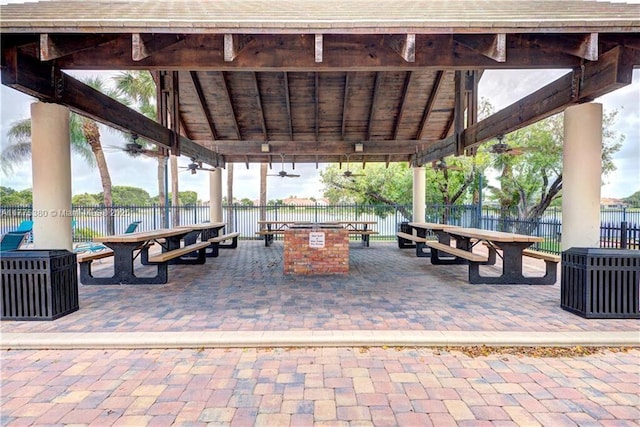 10766 Crescendo Cir, Boca Raton, FL 33498 - view of home's community featuring outdoor dining space, fence, and a gazebo