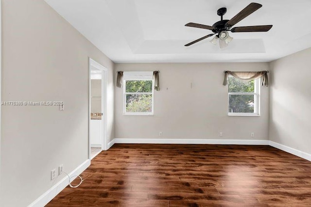 10766 Crescendo Cir, Boca Raton, FL 33498 - unfurnished room featuring wood finished floors, baseboards, ceiling fan, and a raised ceiling