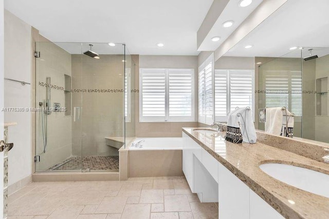 10766 Crescendo Cir, Boca Raton, FL 33498 - full bathroom featuring a shower stall, a bath, recessed lighting, double vanity, and stone tile flooring