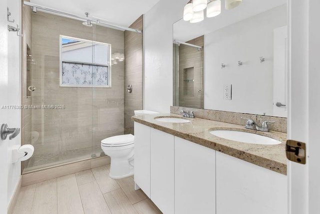 10766 Crescendo Cir, Boca Raton, FL 33498 - bathroom with a stall shower, toilet, and double vanity