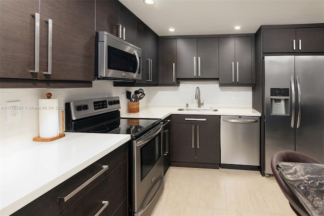 2301 S Ocean Dr Unit 1107, Hollywood, FL 33019 - kitchen featuring recessed lighting, appliances with stainless steel finishes, decorative backsplash, and a sink