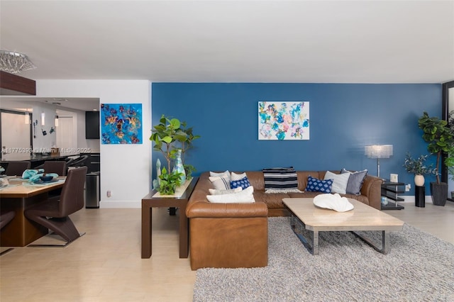 2301 S Ocean Dr Unit 1107, Hollywood, FL 33019 - living room featuring baseboards