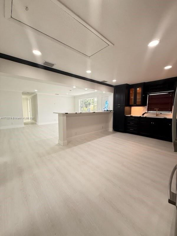 4529 SW 24th St, Fort Lauderdale, FL 33317 - unfurnished living room with visible vents, baseboards, light wood-type flooring, recessed lighting, and attic access