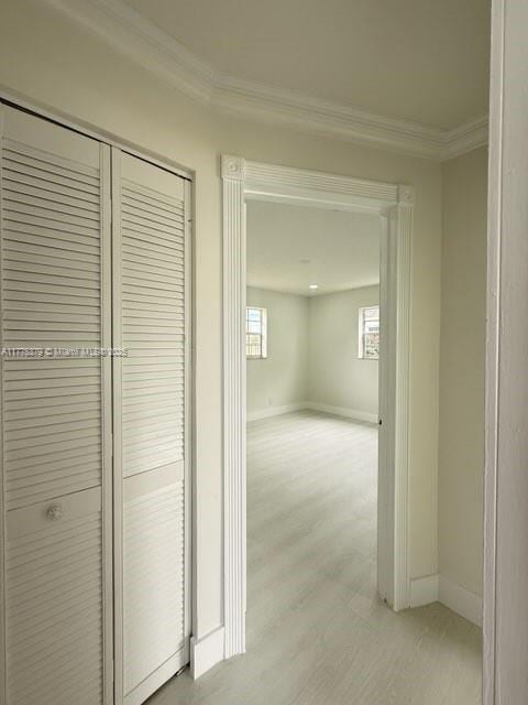 4529 SW 24th St, Fort Lauderdale, FL 33317 - hall featuring light wood-style floors, baseboards, and ornamental molding