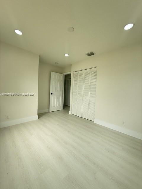 4529 SW 24th St, Fort Lauderdale, FL 33317 - unfurnished bedroom with light wood-style floors, baseboards, visible vents, and recessed lighting