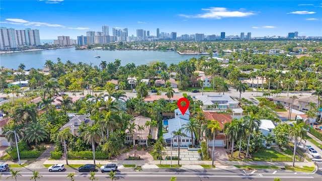 bird's eye view featuring a water view and a city view