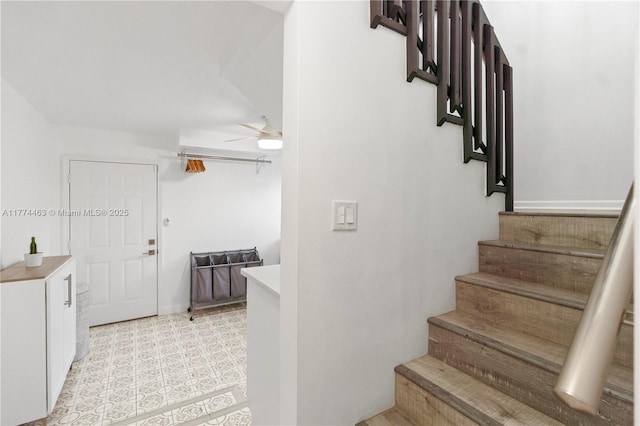 stairway with ceiling fan