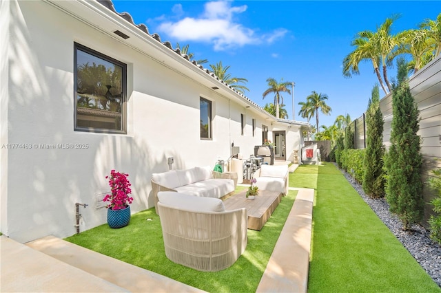 view of yard featuring a patio area, a fenced backyard, and an outdoor living space
