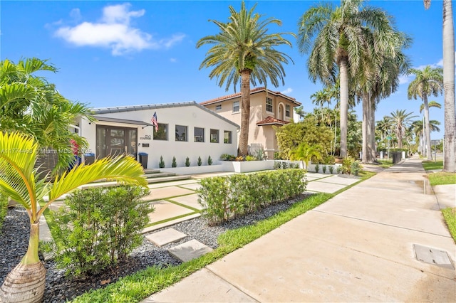 mediterranean / spanish-style house with stucco siding