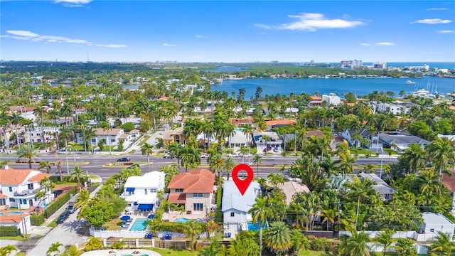 birds eye view of property featuring a water view and a residential view