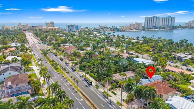 drone / aerial view featuring a water view and a view of city