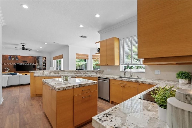 1427 Victoria Isle Dr, Weston, FL 33327 - kitchen featuring a sink, dishwasher, crown molding, a peninsula, and light wood-style floors