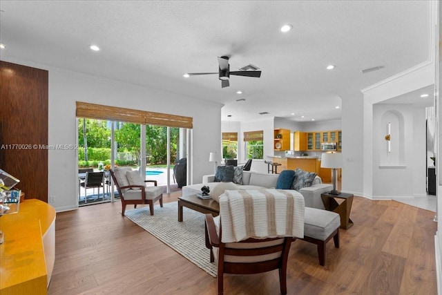 1427 Victoria Isle Dr, Weston, FL 33327 - living area featuring ceiling fan, ornamental molding, baseboards, recessed lighting, and light wood finished floors