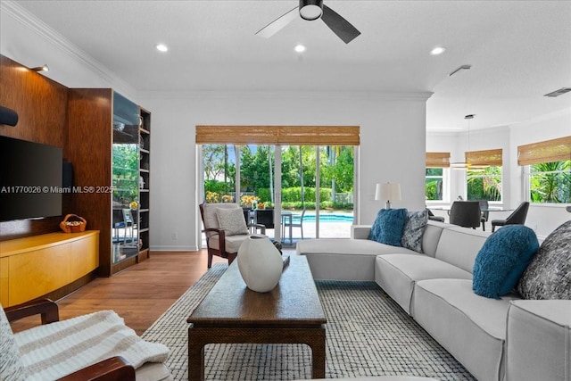 1427 Victoria Isle Dr, Weston, FL 33327 - living room with wood finished floors, ornamental molding, a ceiling fan, and recessed lighting