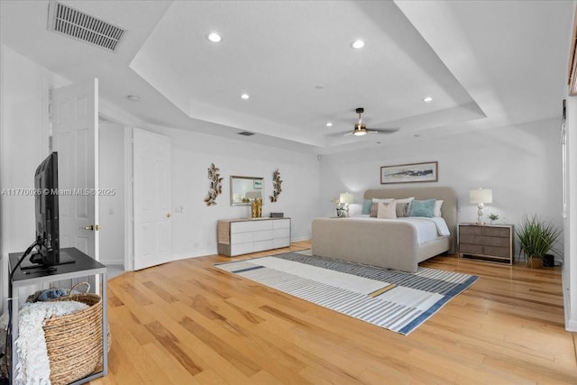 1427 Victoria Isle Dr, Weston, FL 33327 - bedroom with a tray ceiling, recessed lighting, wood finished floors, a ceiling fan, and baseboards