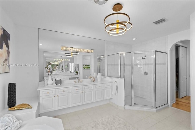 1427 Victoria Isle Dr, Weston, FL 33327 - bathroom featuring a chandelier, vanity, a stall shower, and a tub