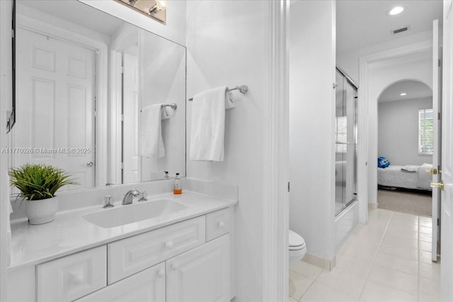 1427 Victoria Isle Dr, Weston, FL 33327 - bathroom with a shower with shower door, tile patterned flooring, toilet, vanity, and recessed lighting