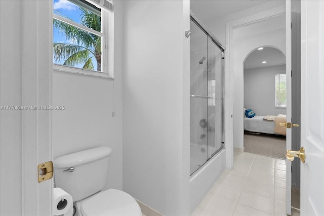 1427 Victoria Isle Dr, Weston, FL 33327 - ensuite bathroom featuring toilet, shower / bath combination with glass door, tile patterned floors, recessed lighting, and french doors