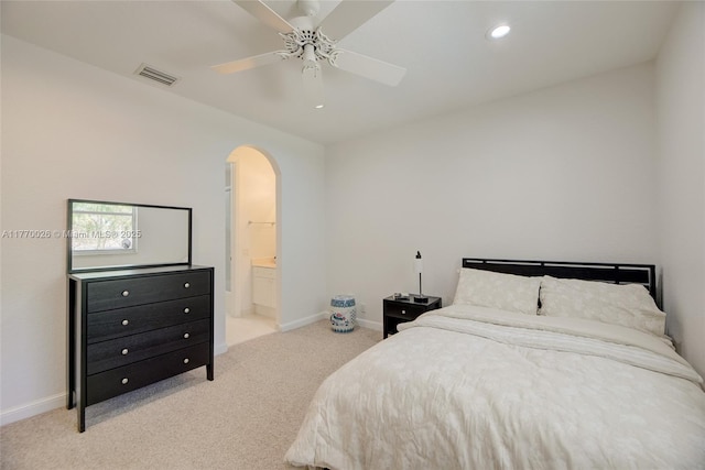 bedroom with baseboards, recessed lighting, carpet floors, visible vents, and arched walkways