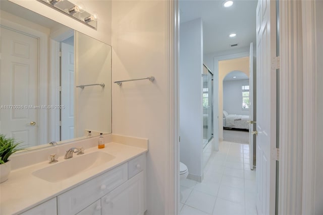 bathroom with vanity, tile patterned flooring, recessed lighting, toilet, and baseboards