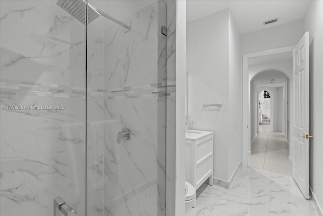 1427 Victoria Isle Dr, Weston, FL 33327 - full bathroom featuring a marble finish shower, marble finish flooring, vanity, baseboards, and toilet
