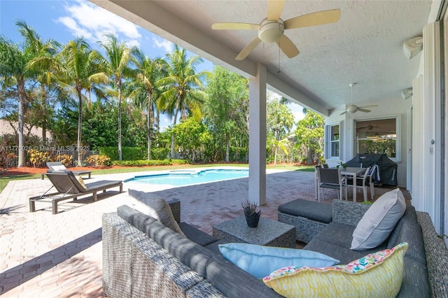 view of patio / terrace with a fenced in pool, an outdoor living space, area for grilling, a fenced backyard, and ceiling fan