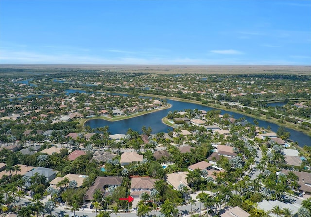 drone / aerial view featuring a water view and a residential view