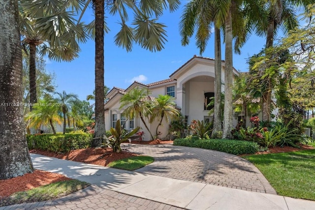 1427 Victoria Isle Dr, Weston, FL 33327 - mediterranean / spanish home featuring stucco siding and decorative driveway