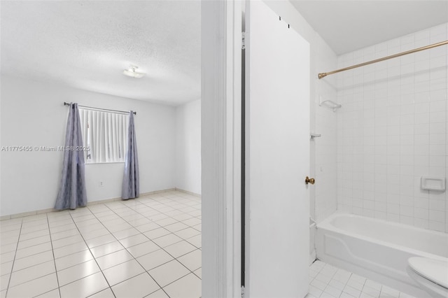 20747 SW 81st Pl Unit 20747, Cutler Bay, FL 33189 - full bathroom with toilet, baseboards, bathtub / shower combination, a textured ceiling, and tile patterned floors