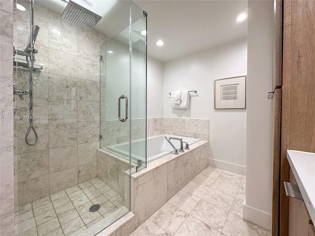 1331 Brickell Bay Dr Unit 506, Miami, FL 33131 - bathroom with a shower stall, a bath, vanity, baseboards, and recessed lighting