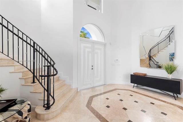 455 Centre Is, Golden Beach, FL 33160 - entrance foyer featuring baseboards, stairs, and a high ceiling