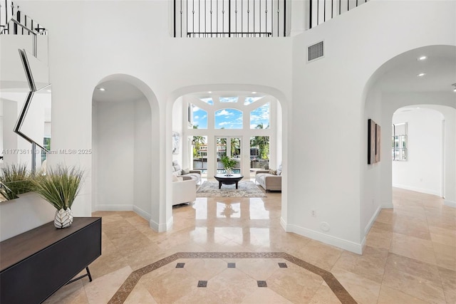 455 Centre Is, Golden Beach, FL 33160 - entryway with visible vents, baseboards, and a high ceiling