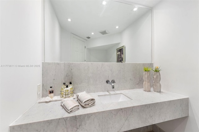 455 Centre Is, Golden Beach, FL 33160 - bathroom featuring a sink, backsplash, recessed lighting, and visible vents