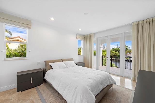455 Centre Is, Golden Beach, FL 33160 - bedroom with baseboards, recessed lighting, access to outside, a water view, and french doors