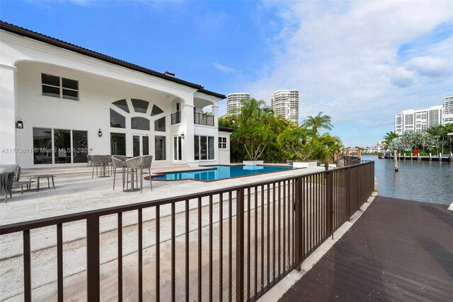 455 Centre Is, Golden Beach, FL 33160 - outdoor pool with a water view and a patio area