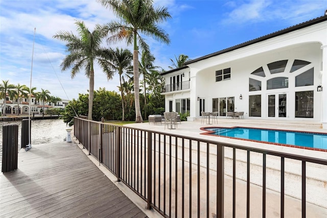 455 Centre Is, Golden Beach, FL 33160 - pool with a water view, a patio area, and a dock