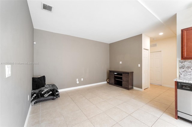 unfurnished room with light tile patterned floors, recessed lighting, baseboards, and visible vents