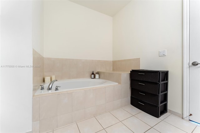 bathroom with tile patterned flooring and a garden tub