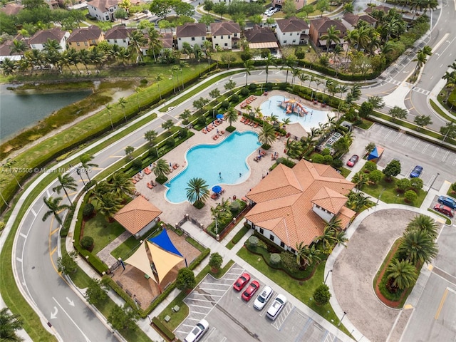 birds eye view of property with a residential view and a water view