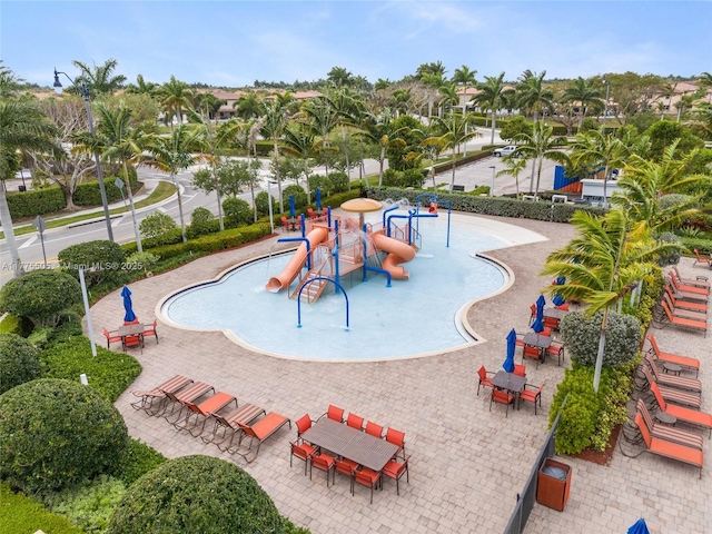 view of pool featuring playground community